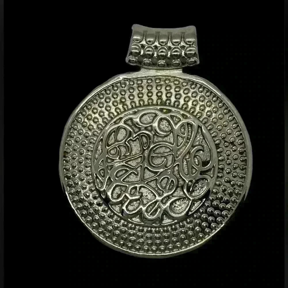 Lovely 2 1/2 inch silver pendant.